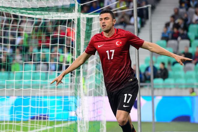 Turkey's Burak Yilmaz celebrates after scoring a goal during the friendly football match against Slovenia. (AFP Photo)