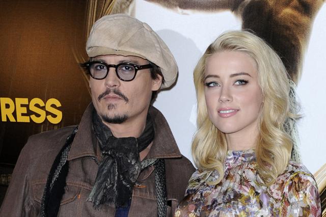 Johnny Depp and Amber Heard pose for photographers during a photocall for the film The Rum Diary in Paris. (REUTERS) Johnny Depp and Amber Heard pose for photographers during a photocall for the film The Rum Diary in Paris. (REUTERS)