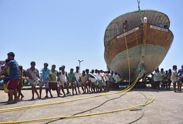 The boats will be pulled far from the water line to protect them from the monster waves during the monsoon. The boats are repaired and painted during this period of forced inactivity for the fishermen (Hindustan Times)