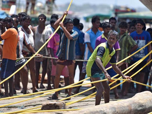 The boats will be pulled far from the water line to protect them from the monster waves during the monsoon. The boats are repaired and painted during this period of forced inactivity for the fishermen (Hindustan Times)