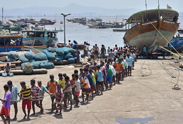 The boats will be pulled far from the water line to protect them from the monster waves during the monsoon. The boats are repaired and painted during this period of forced inactivity for the fishermen (Hindustan Times)