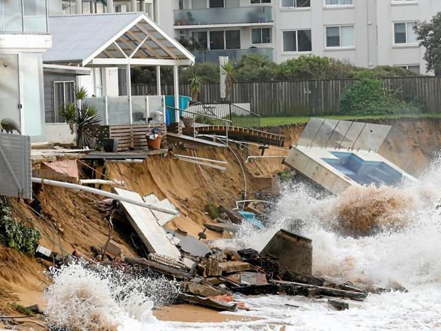 A wave crashes against a swimming pool and properties after they were damaged by severe weather, which brought strong winds and heavy rain to the east coast of Australia, at Collaroy beach in Sydney. (Reuters) A wave crashes against a swimming pool and properties after they were damaged by severe weather, which brought strong winds and heavy rain to the east coast of Australia, at Collaroy beach in Sydney. (Reuters)