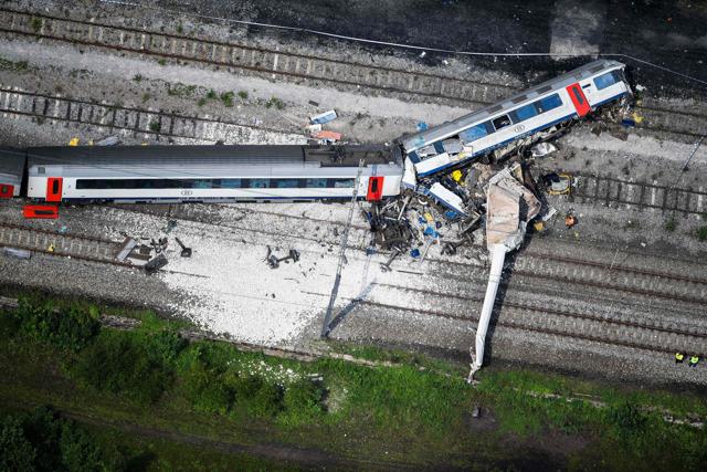 This aerial picture taken on June 6, 2016, shows the scene of a collision between a freight train and a passengers train on their way between Liege and Namur. (AFP) This aerial picture taken on June 6, 2016, shows the scene of a collision between a freight train and a passengers train on their way between Liege and Namur. (AFP)