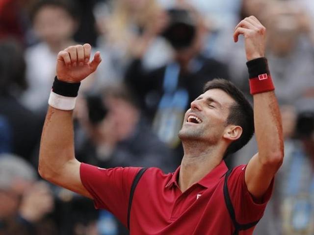 Serbia's Novak Djokovic poses with his trophy after winning the men's final match against Britain's Andy Murray at the Roland Garros French Tennis Open in Paris on June 5 (AFP) Serbia's Novak Djokovic poses with his trophy after winning the men's final match against Britain's Andy Murray at the Roland Garros French Tennis Open in Paris on June 5 (AFP)
