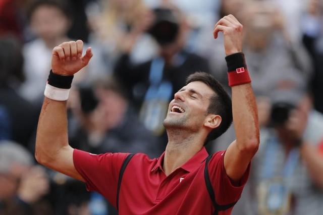 Djokovic celebrates after winning his maiden French Open title on Sunday. (Reuters Photo) Djokovic celebrates after winning his maiden French Open title on Sunday. (Reuters Photo)