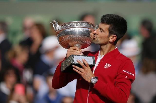 Novak Djokovic celebrates his French Open title win with ball girls. (Reuters) Novak Djokovic celebrates his French Open title win with ball girls. (Reuters)
