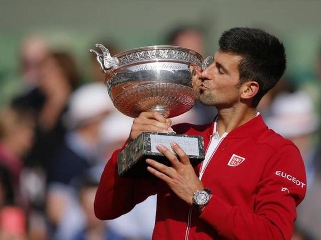 Novak Djokovic celebrates after winning the French Tennis Open on Sunday.(Reuters Photo)