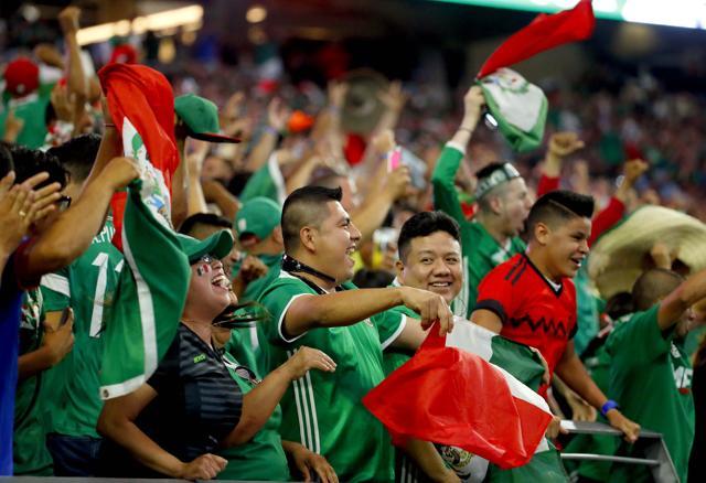 Mexico fans cheer after a goal against Uruguay during the second half of a Copa America group C football match at University of Phoenix Stadium. (AP Photo)