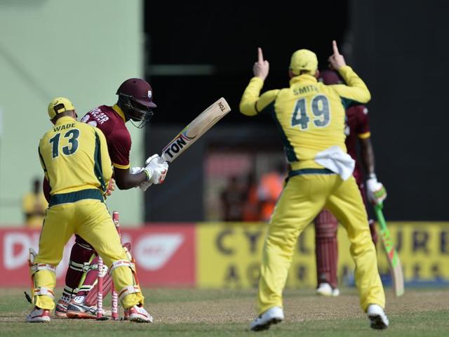 The West Indies captain Jason Holder is bowled by Australia's Adam Zampa during a One-day International (ODI) cricket match between the West Indies and Australia in the tri-nation series in Georgetown, Guyana. (AFP Photo) The West Indies captain Jason Holder is bowled by Australia's Adam Zampa during a One-day International (ODI) cricket match between the West Indies and Australia in the tri-nation series in Georgetown, Guyana. (AFP Photo)