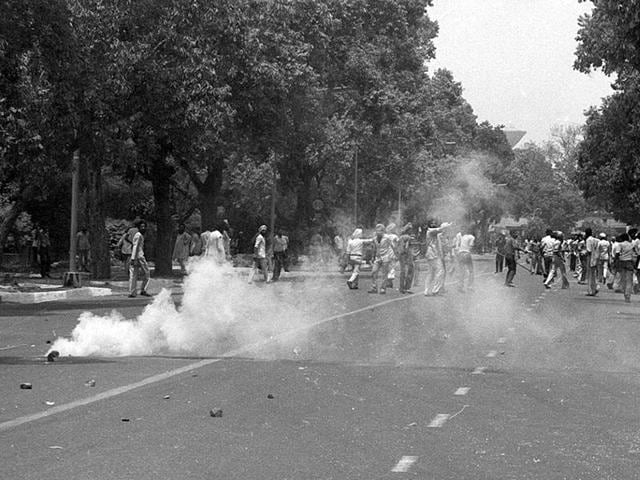 Police fire teargas shells to disperse the crowd pelting stones at police near Bangla Sahib Gurudwara in New Delhi. Sikhs were upset after the action in Golden Temple in June 1984 which the Sikh community felt was the desecration of Golden Temple by the Indian Army. (Ajit Kumar/HT File Photo ) Police fire teargas shells to disperse the crowd pelting stones at police near Bangla Sahib Gurudwara in New Delhi. Sikhs were upset after the action in Golden Temple in June 1984 which the Sikh community felt was the desecration of Golden Temple by the Indian Army. (Ajit Kumar/HT File Photo )