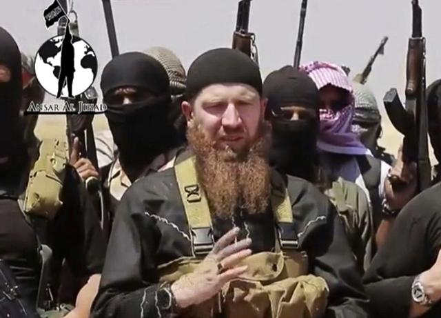 This file image made from undated video posted on a social media account frequently used for communications by the Islamic State shows Omar al-Shishani standing next to the group's spokesperson among a group of fighters as they declare the elimination of the border between Iraq and Syria. (AP) This file image made from undated video posted on a social media account frequently used for communications by the Islamic State shows Omar al-Shishani standing next to the group's spokesperson among a group of fighters as they declare the elimination of the border between Iraq and Syria. (AP)
