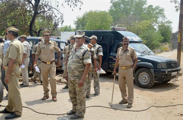 Police officers outside Jawahar Bagh in Mathura on Sunday. (PTI Photo) Police officers outside Jawahar Bagh in Mathura on Sunday. (PTI Photo)