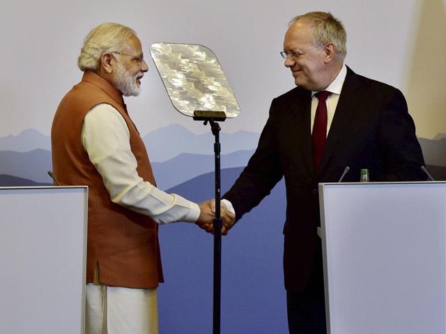 Prime Minister Narendra Modi greets Switzerland President Johann Schneider-Ammann during their press statement in Geneva, Switzerland on Monday. (PTI) Prime Minister Narendra Modi greets Switzerland President Johann Schneider-Ammann during their press statement in Geneva, Switzerland on Monday. (PTI)
