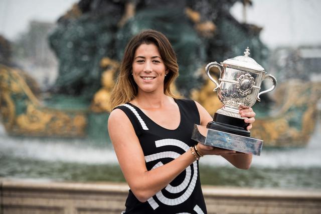 Spain's Garbine Muguruza poses for photographers with her trophy, one day after winning her women's final match against US player Serena Williams at the Roland Garros 2016 French Tennis Open. (AFP Photo) Spain's Garbine Muguruza poses for photographers with her trophy, one day after winning her women's final match against US player Serena Williams at the Roland Garros 2016 French Tennis Open. (AFP Photo)