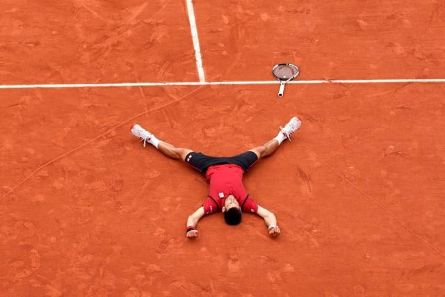 Serbia's Novak Djokovic reacts after winning the men's final match against Britain's Andy Murray at the Roland Garros 2016 French Tennis Open in Paris. (AFP Photo) Serbia's Novak Djokovic reacts after winning the men's final match against Britain's Andy Murray at the Roland Garros 2016 French Tennis Open in Paris. (AFP Photo)