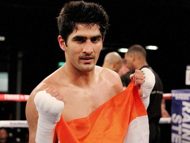Boxer Vijender Singh celebrates his sixth successive victory in Pro-boxing after a comfortable knockout win over Poland's Andrzej Soldra in Bolton.(PTI Photo)