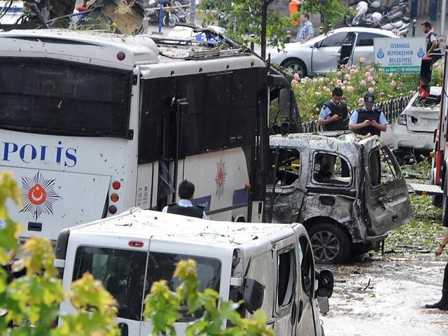 Police officers and rescuers inspect the site of a bomb attack that targeted a police bus in the Vezneciler district of Istanbul. (AFP) Police officers and rescuers inspect the site of a bomb attack that targeted a police bus in the Vezneciler district of Istanbul. (AFP)