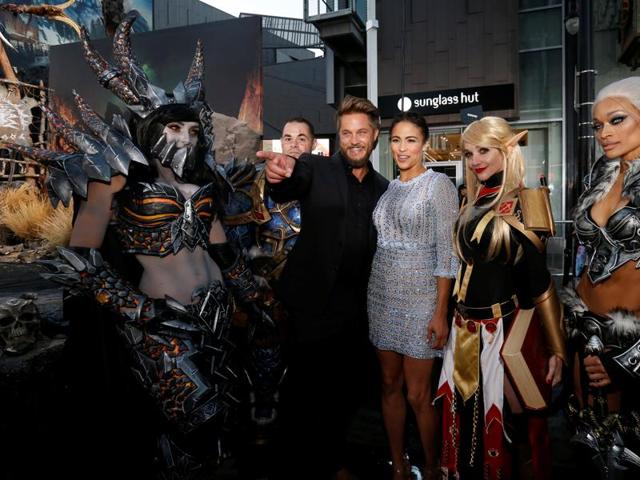 Cast members Paula Patton and Travis Fimmel pose with cosplay enthusiasts at the premiere of the Warcraft movie in Hollywood. (REUTERS) Cast members Paula Patton and Travis Fimmel pose with cosplay enthusiasts at the premiere of the Warcraft movie in Hollywood. (REUTERS)