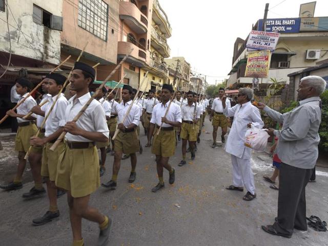 Volunteers parade through the streets during a training session. (Sonu Mehta/HT Photo)
