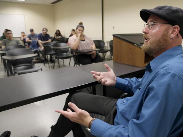 Ryan Reyes, whose partner Daniel Kaufman was killed in the San Bernardino terrorist attack, speaks to students at California State University. (AP) Ryan Reyes, whose partner Daniel Kaufman was killed in the San Bernardino terrorist attack, speaks to students at California State University. (AP)