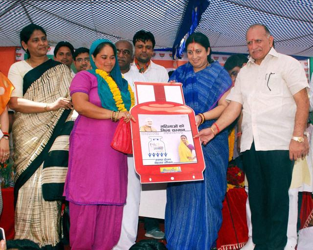 Sri Ganganagar : Minister of Human Resource Development Smriti Irani distributing free LPG connection under Pradhan Mantri Ujjwala Yojana at Sri Ganganagar on Sunday. The Congress has accused the government of inflating the magnitude of its achievements on various fronts, including LPG connections supplied. (PTI) Sri Ganganagar : Minister of Human Resource Development Smriti Irani distributing free LPG connection under Pradhan Mantri Ujjwala Yojana at Sri Ganganagar on Sunday. The Congress has accused the government of inflating the magnitude of its achievements on various fronts, including LPG connections supplied. (PTI)