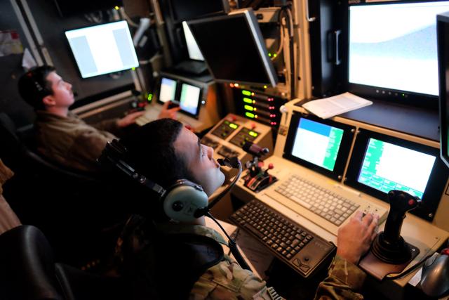 U.S. airmen control a US Air Force drone from a command trailer at Kandahar Air Field, Afghanistan March 9, 2016. (REUTERS)