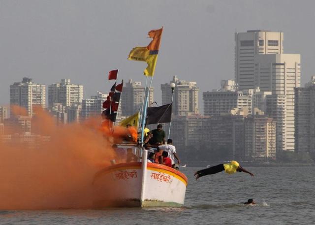 Here they simulate a rescue from a fishing boat that is on  fire. Firefighters often have respond to distress calls from small craft close to the shoreline.  (Bhushan Koyande) 