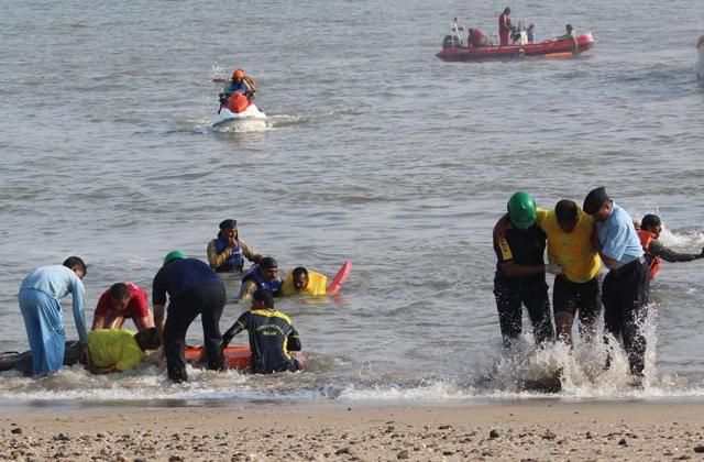 Fire fighters carrying out a pre-monsoon rescue drill in the Arabian Sea near marine drive at Girgaum Chowpatty  in Mumbai on Tuesday (Satyabrata Tripathy) 