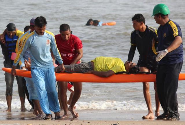 Fire fighters carrying out a pre-monsoon rescue drill in the Arabian Sea near marine drive at Girgaum Chowpatty  in Mumbai on Tuesday. (Satyabrata Tripathy) 