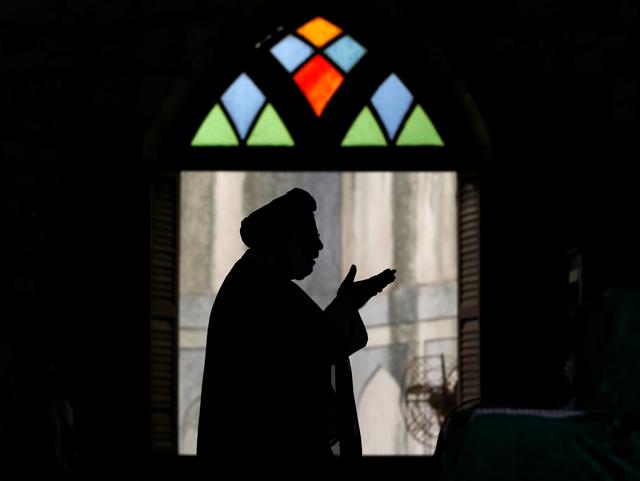 A cleric leads afternoon prayers during Ramzan in Mumbai. During this month, Muslims fast from dawn till sunset, refraining from eating, drinking any liquids and smoking. (REUTERS) A cleric leads afternoon prayers during Ramzan in Mumbai. During this month, Muslims fast from dawn till sunset, refraining from eating, drinking any liquids and smoking. (REUTERS)