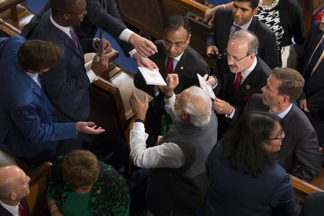 Prime Minister Narendra Modi signs autographs for members of Congress after his address to a joint meeting of Congress on Capitol Hill in Washington, Wednesday. (AP Photo) Prime Minister Narendra Modi signs autographs for members of Congress after his address to a joint meeting of Congress on Capitol Hill in Washington, Wednesday. (AP Photo)