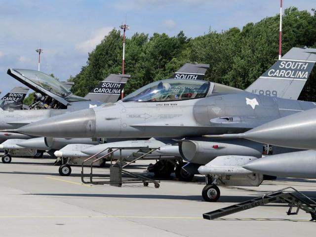 FILE PHOTO - Pilots from the South Carolina Air National Guard's 169th Fighter Wing prepare to leave Lask Air Base, Poland June 22, 2015. Two South Carolina Air National Guard fighter pilots ejected safely from their jets after they collided over eastern Georgia while performing routine night operations.(REUTERS)