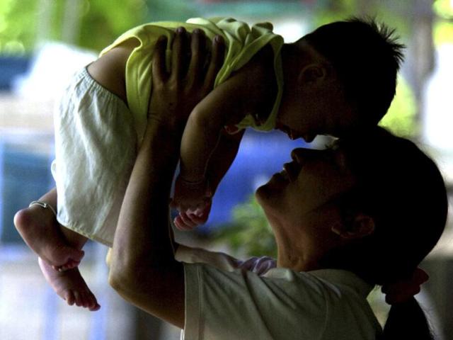 In this file photo, an HIV-positive mother plays with her son, who did not contract the virus from her, in Phetchaburi province, south of Bangkok. (AP) In this file photo, an HIV-positive mother plays with her son, who did not contract the virus from her, in Phetchaburi province, south of Bangkok. (AP)