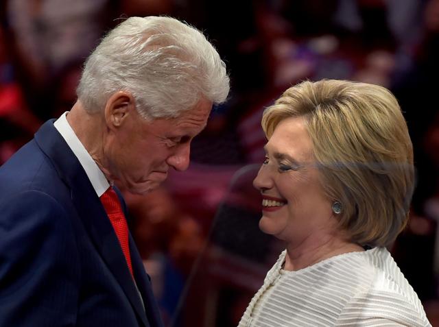 Democratic presidential candidate Hillary Clinton shares a moment on stage with husband, former US president Bill Clinton during her primary night event at the Duggal Greenhouse, Brooklyn Navy Yard, June 7, 2016 in New York. (AFP) Democratic presidential candidate Hillary Clinton shares a moment on stage with husband, former US president Bill Clinton during her primary night event at the Duggal Greenhouse, Brooklyn Navy Yard, June 7, 2016 in New York. (AFP)