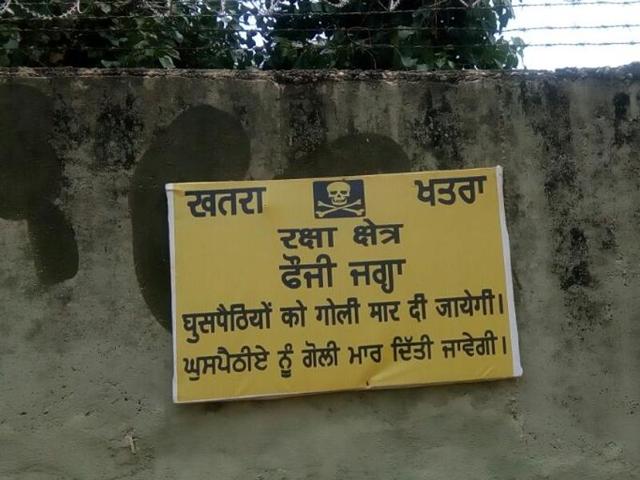 Wall of Pathankot Air Force Station bearing a warning message. (HT Photo) Wall of Pathankot Air Force Station bearing a warning message. (HT Photo)
