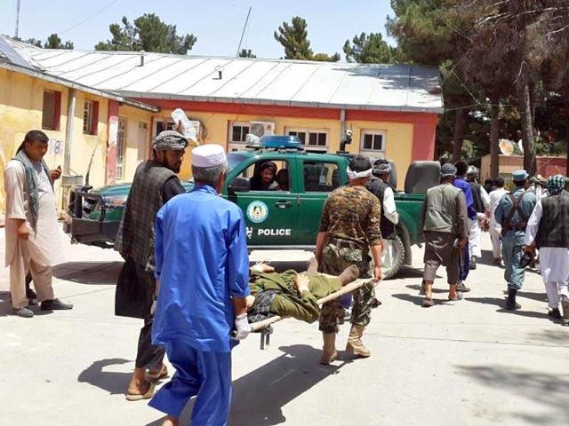 Afghan men carry an injured man to a hospital after a suicide attack. (AFP File P hoto) Afghan men carry an injured man to a hospital after a suicide attack. (AFP File P hoto)