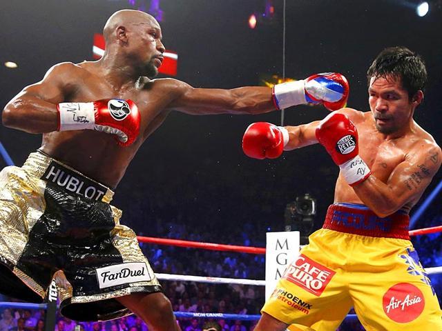 The retirement of Floyd Mayweather Jr. (left) and Manny Pacquiao has resulted in both dropping down the list. (Reuters)