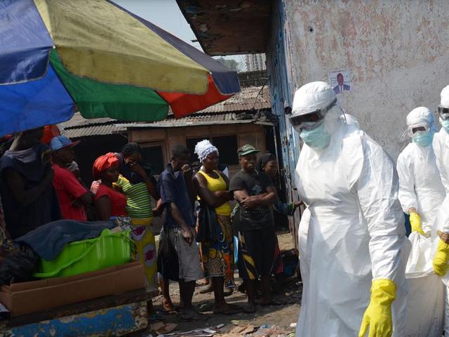 This file photo shows a man walking past an Ebola campaign banner with the new slogan "Ebola Must GO" in Monrovia. (AFP File Photo) This file photo shows a man walking past an Ebola campaign banner with the new slogan "Ebola Must GO" in Monrovia. (AFP File Photo)