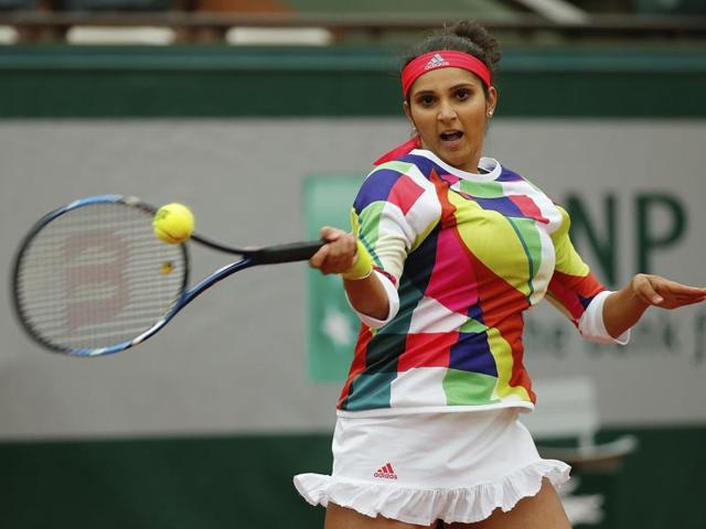 Sania Mirza hits a return when playing with Croatia’s Ivan Dodic in the final of the mixed doubles match of the French Open tennis tournament. (AP Photo) Sania Mirza hits a return when playing with Croatia’s Ivan Dodic in the final of the mixed doubles match of the French Open tennis tournament. (AP Photo)