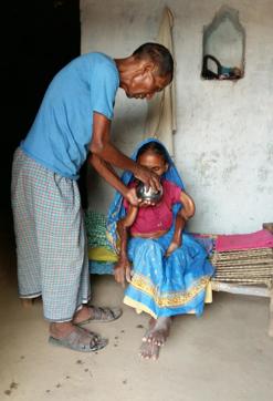 Husband of skeletal fluorosis patient Rampatia Devi offering water at Pratappur village in Garhwa. (B Vijay Murty/ Hindustan Times) Husband of skeletal fluorosis patient Rampatia Devi offering water at Pratappur village in Garhwa. (B Vijay Murty/ Hindustan Times)