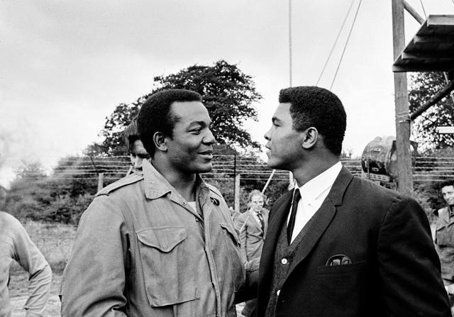 Heavyweight boxer Muhammad Ali (right) visits Cleveland Browns running back and actor Jim Brown on the film set of "The Dirty Dozen" at Morkyate, Bedfordshire, England. (AP File Photo) Heavyweight boxer Muhammad Ali (right) visits Cleveland Browns running back and actor Jim Brown on the film set of "The Dirty Dozen" at Morkyate, Bedfordshire, England. (AP File Photo)