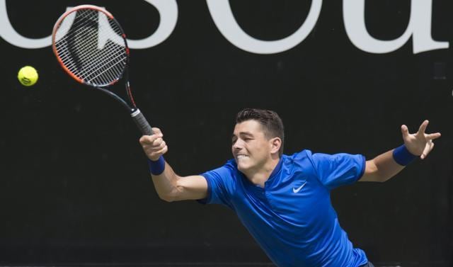 Taylor Fritz from the USA returns the ball to Switzerland's Roger Federer in their round of sixteen match at the ATP Mercedes Cup tennis tournament. (AFP Photo) Taylor Fritz from the USA returns the ball to Switzerland's Roger Federer in their round of sixteen match at the ATP Mercedes Cup tennis tournament. (AFP Photo)