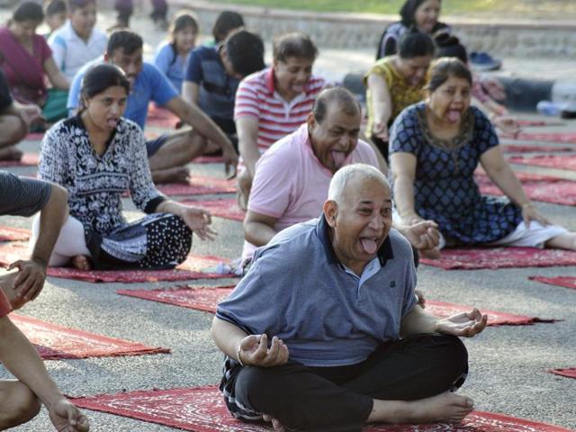City people taking part in yoga camp at Sukhna Lake , Chandigarh on Tuesday. (Karun Sharma/HT Photo)