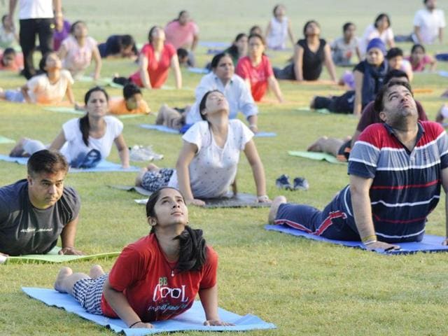 People taking part in yoga camp at Punjab University, Chandigarh on Tuesday. (Karun Sharma/HT Photo)