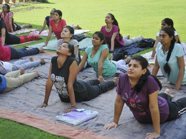 Guru Gobind Singh College students doing yoga in Chandigarh. (Karun Sharma/HT Photo)