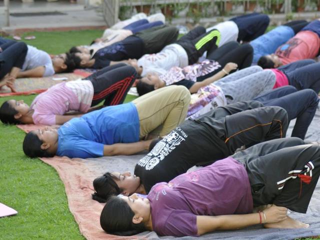 Guru Gobind Singh College students doing yoga in Chandigarh. (Karun Sharma/HT Photo)