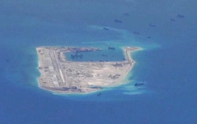 Chinese dredging vessels are purportedly seen in the waters around Fiery Cross Reef in the disputed Spratly Islands in the South China Sea in this image from video taken by a P-8A Poseidon surveillance aircraft provided by the United States Navy, May 21, 2015. (REUTERS) Chinese dredging vessels are purportedly seen in the waters around Fiery Cross Reef in the disputed Spratly Islands in the South China Sea in this image from video taken by a P-8A Poseidon surveillance aircraft provided by the United States Navy, May 21, 2015. (REUTERS)