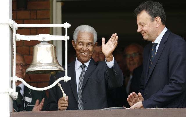 Sir Garfield Sobers rings the bell before the afternoon session as a tribute to Muhammad Ali . (Reuters Photo)