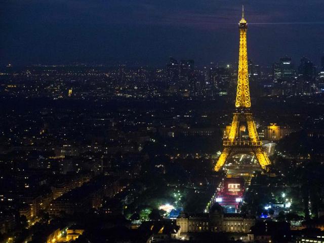 The Eiffel also reverted to its standard yellow lighting during the concert. (AFP)