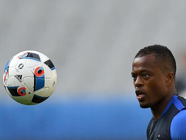 Defender Patrice Evra has his eye on the ball. (AFP) 
